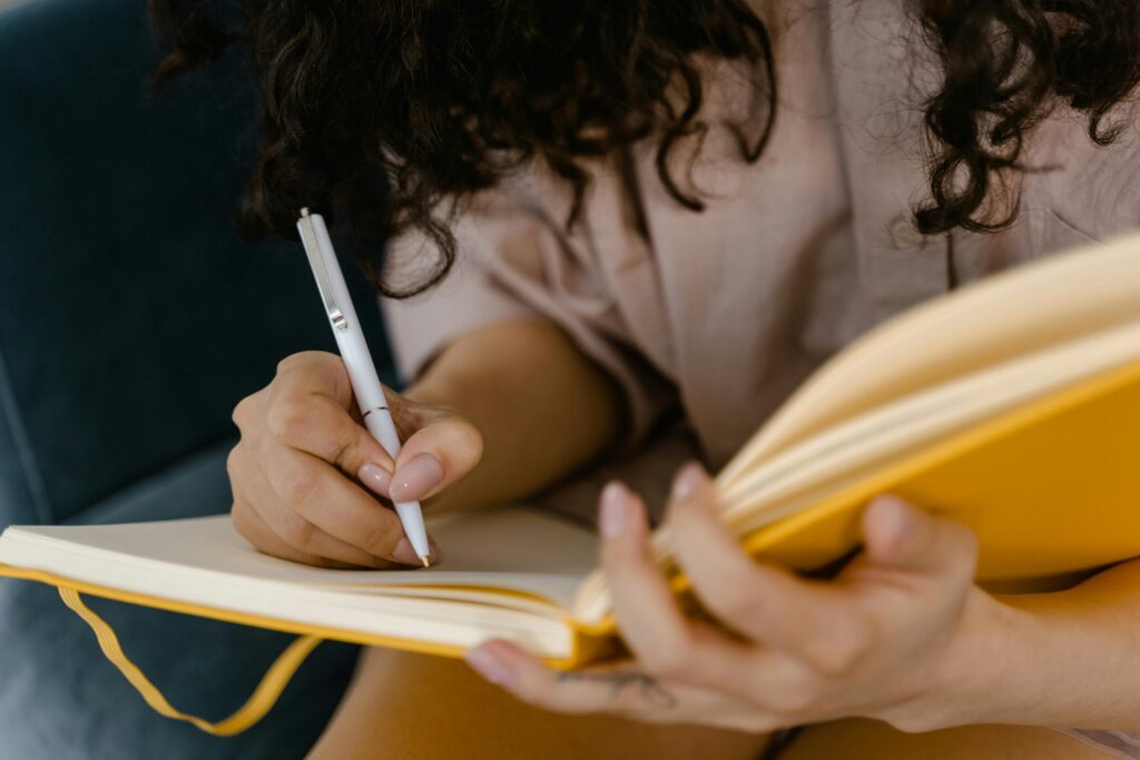 Client journaling before virtual therapy session to process feelings in California