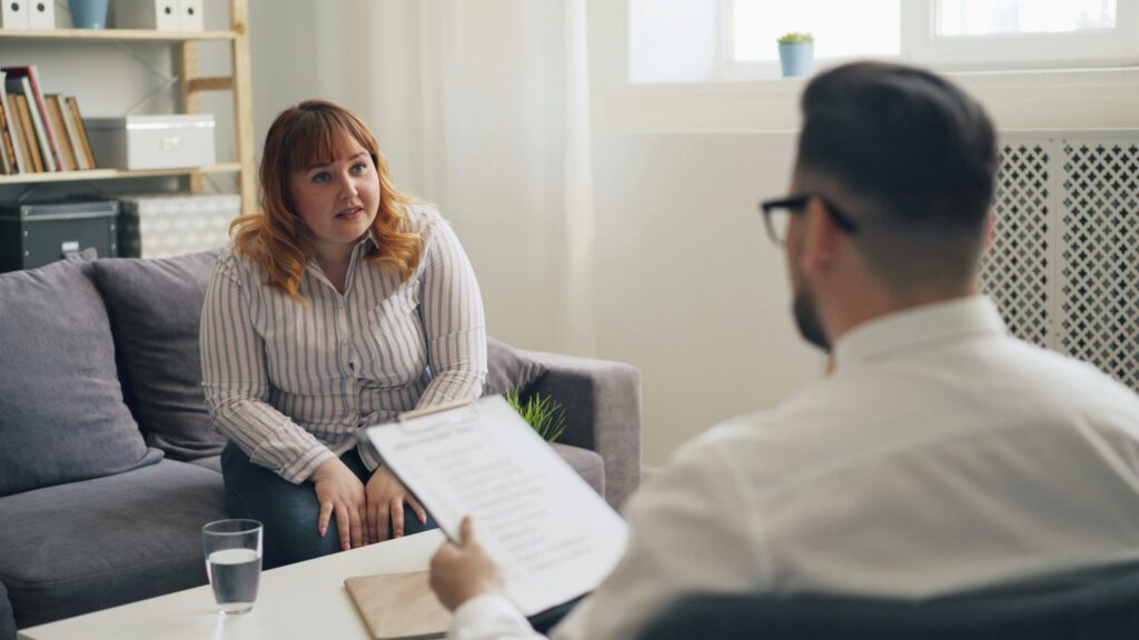 Therapist listening and validating client during emotional therapy session in California